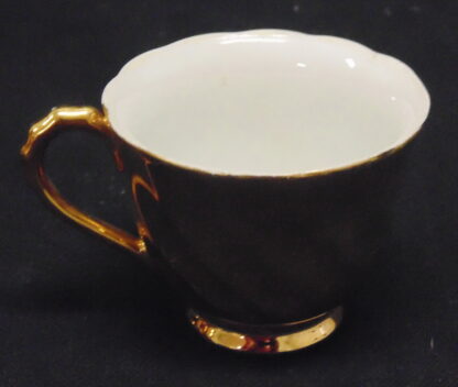 Gold Porcelain Coffee Cup, chipped