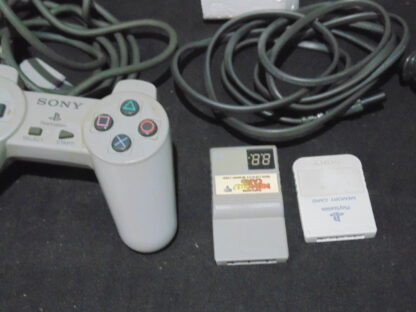 PS1 Sony Play Station with two joy sticks and 2 memory cards