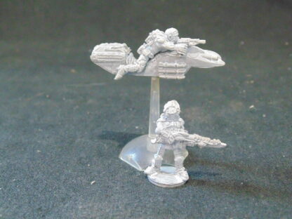 Metal figures, one on a speeder