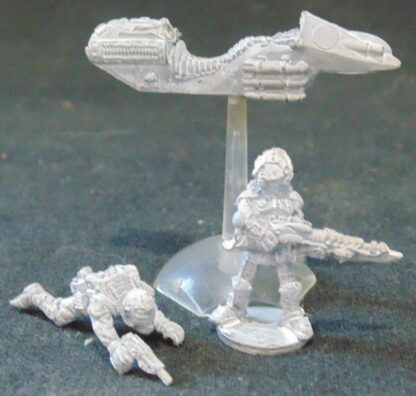 Metal figures, one on a speeder