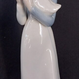 Girl holding a duck, in the, style of, NAO Lladro