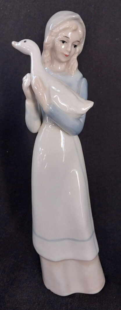 Girl holding a duck, in the, style of, NAO Lladro